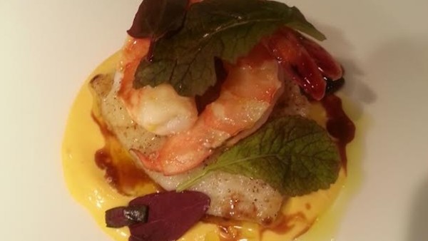 Pan-roasted halibut cheeks with citrus olive oil-poached prawns and saffron aioli