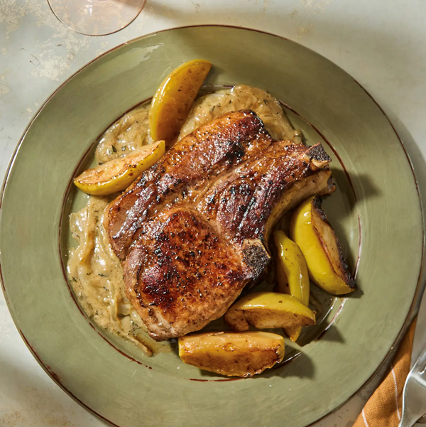 Pan-roasted pork chop with apples and mustard-onion gravy