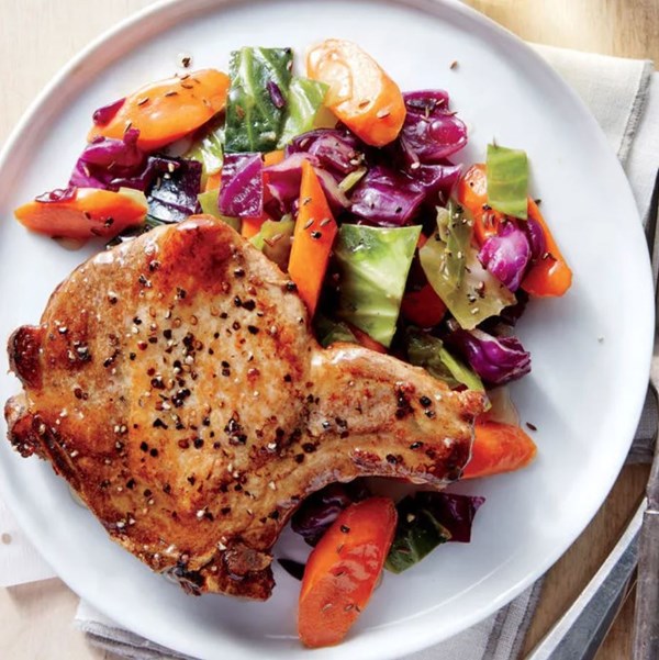 Pan-roasted pork chops with cabbage and carrots