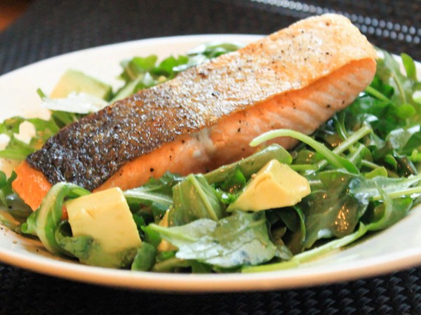 Pan-roasted salmon with arugula and avocado salad