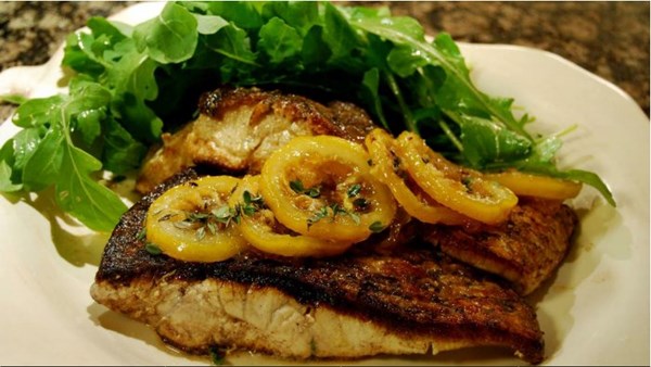 Pan-roasted saltwater barramundi with caramelised lemon and rocket
