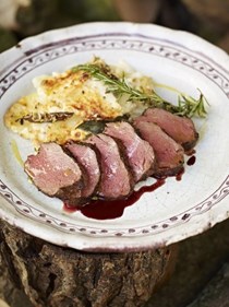 Pan-roasted venison with creamy baked potato and celeriac