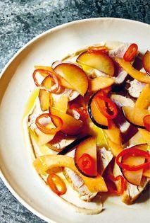 Pan-seared albacore with plums, melon, tahini, and pickled chiles