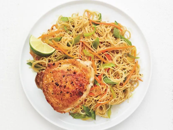 Pan-seared chicken thighs with curried rice noodles