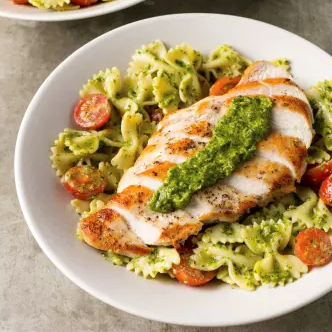 Pan-seared chicken with arugula pesto farfalle
