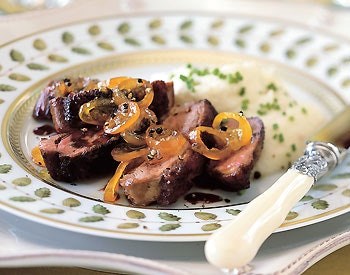Pan-seared duck breasts with kumquats