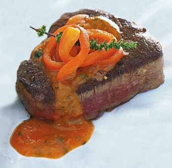 Pan-seared filet mignon with red bell pepper, tomato, and basil sauce