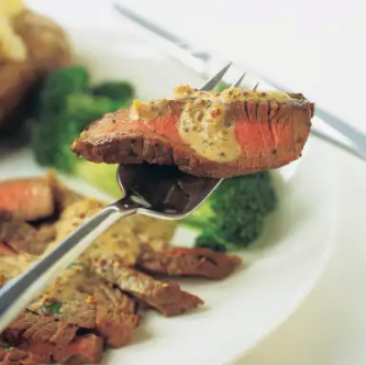 Pan-seared inexpensive steaks with mustard-cream sauce