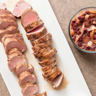 Pan-seared oven-roasted pork tenderloin with garlicky cilantro-lime sauce