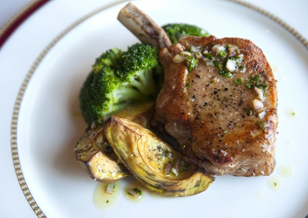 Pan-seared pork chops with roasted avocado, broccoli and sherry vinaigrette