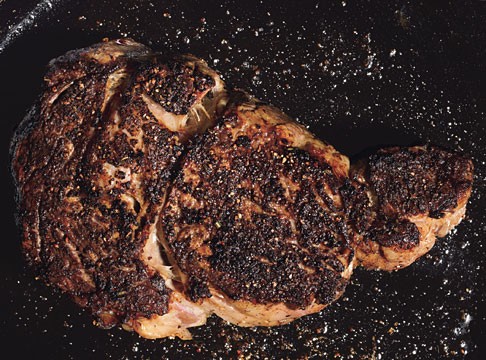 Pan-seared rib-eye steaks with porcini and rosemary rub