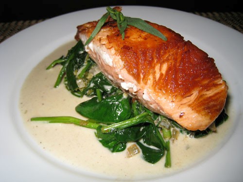 Pan seared salmon on spinach in tarragon sauce