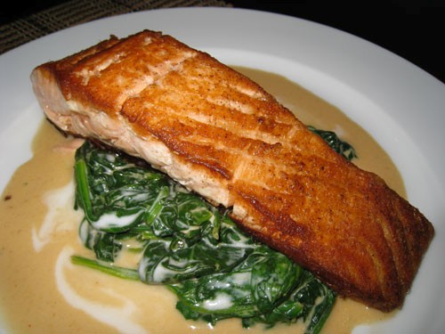 Pan seared salmon on Thai curried spinach