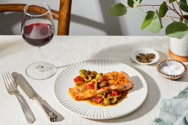 Pan-seared salmon with lemony olive-tomato sauce