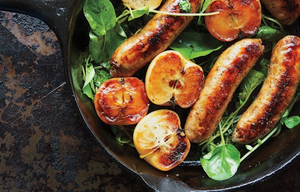 Pan-seared sausage with Lady apples and watercress