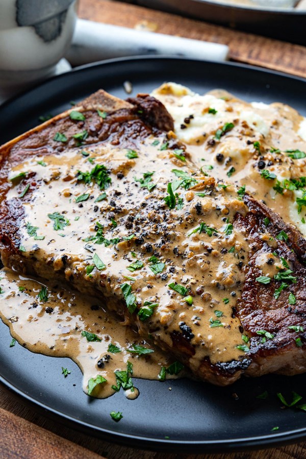 Pan seared steak in creamy peppercorn sauce