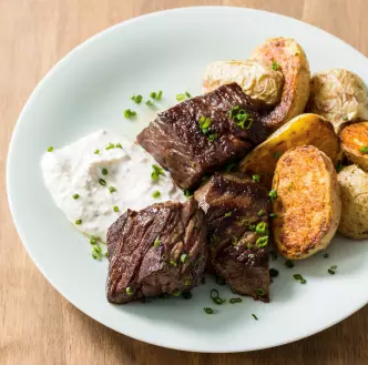 Pan-seared steak tips with roasted potatoes and horseradish cream