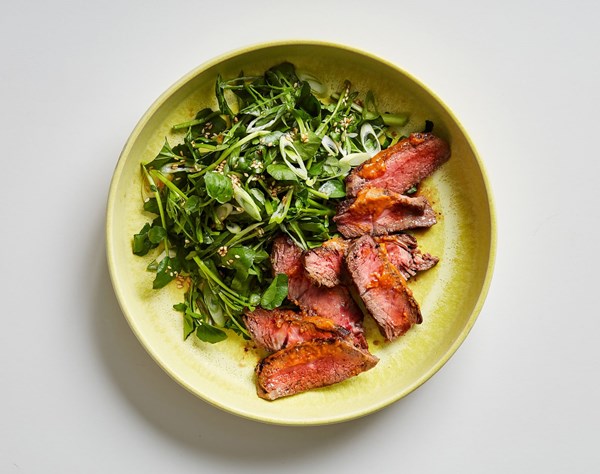 Pan-seared steak with smoky miso butter and watercress salad