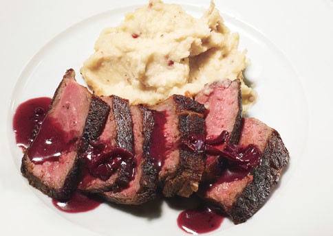 Pan-seared strip steak with red-wine pan sauce and pink-peppercorn butter