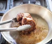 Pan-seared thick-cut strip steaks with sun-dried tomato relish