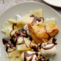 Pancakes with buttered pears, vanilla ice cream and chocolate sauce