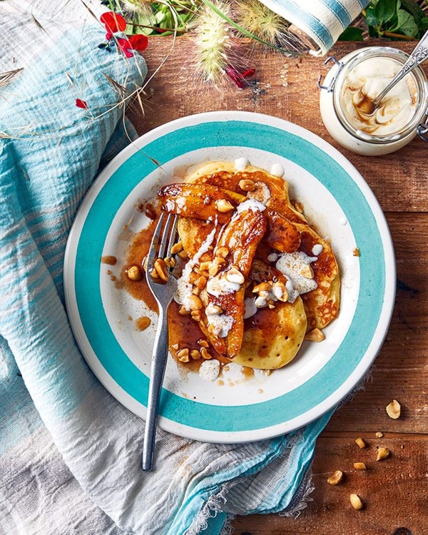 Pancakes with caramel bananas, cinnamon and salted peanuts