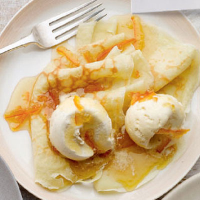 Pancakes with vanilla ice cream with marmalade and whisky sauce