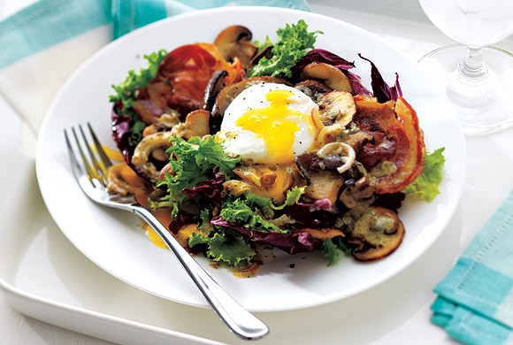 Pancetta and eggs on hearty greens
