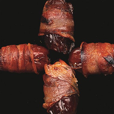 Pancetta-wrapped dates stuffed with Manchego cheese and mint
