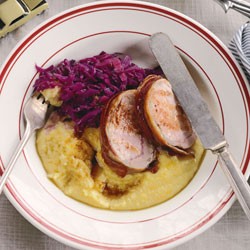 Pancetta-wrapped pork with braised red cabbage and polenta