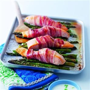 Pancetta-wrapped salmon with griddled asparagus and lime crème fraîche