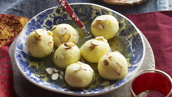 Paneer balls in saffron sugar syrup (Rasgulla)