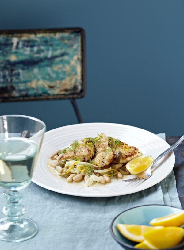 Panfried fish on white beans and fennel
