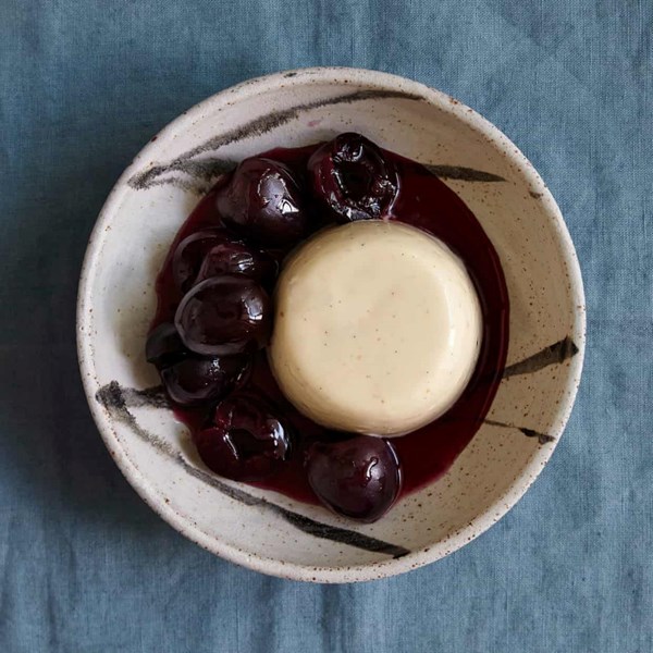 Panna cotta and cherries poached in pastis