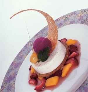 Panna cotta with warm strawberry-mango salsa, hazelnut cookie wafer, prickly pear sorbet, and a caramel halo