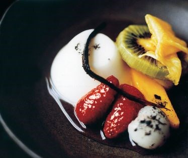 Pannacotta with poached fruits in Champagne syrup
