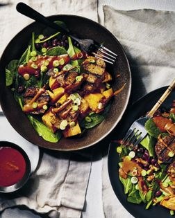 Pantry mole bowl with seitan, spinach salad, and sweet potatoes