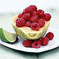 Papaya with raspberries and lime