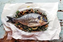 Paper-baked sea bream with mushrooms