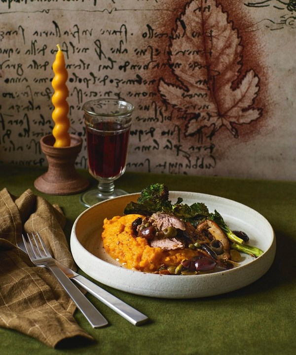 Paper-roasted leg of lamb with lemon, olives & herbs