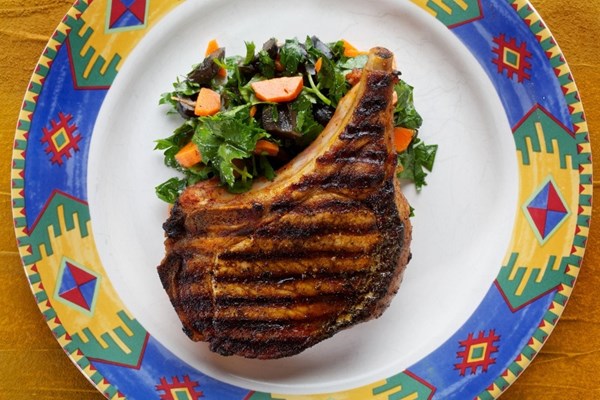 Paprika pork chops with carrot and olive salad