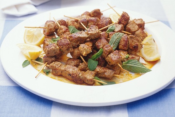 Paprika pork skewers with broad bean salad