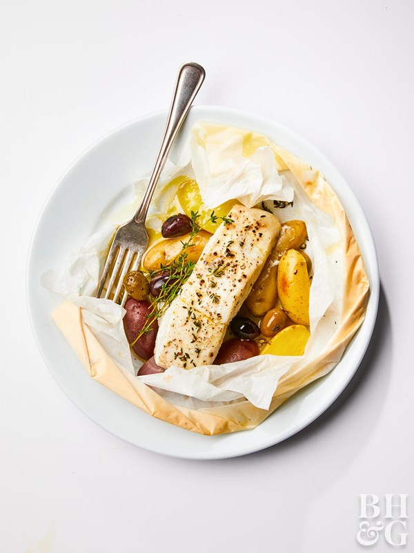 Parchment-baked halibut with thyme and olives