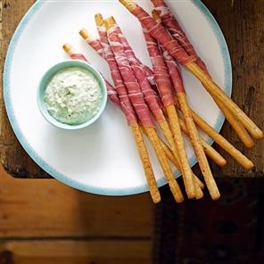 Parma ham-wrapped grissini with pesto dip