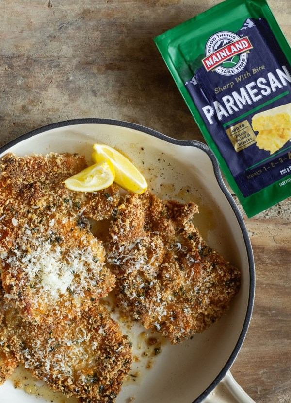 Parmesan and herb crusted chicken schnitzel with tangy slaw