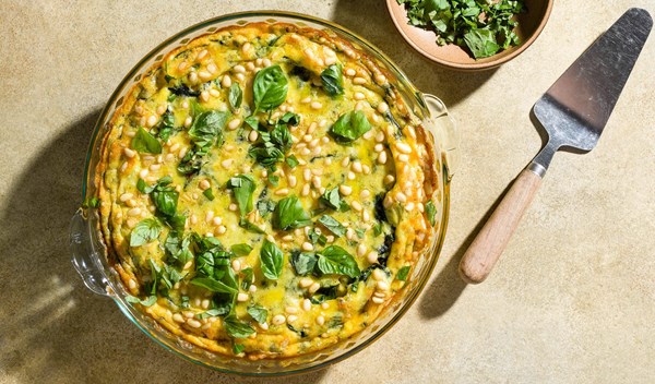 Parmesan baked eggs with potatoes and pine nuts