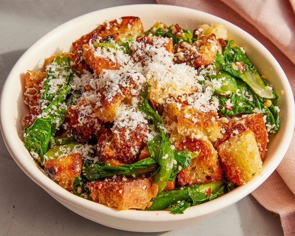 Parmesan-garlic crisped bread with spicy greens (Pancotto)
