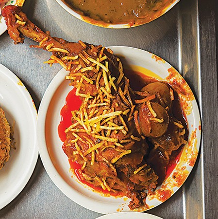 Parsi-style chicken curry with apricots and shoestring potatoes (Jardalu ma marghi)