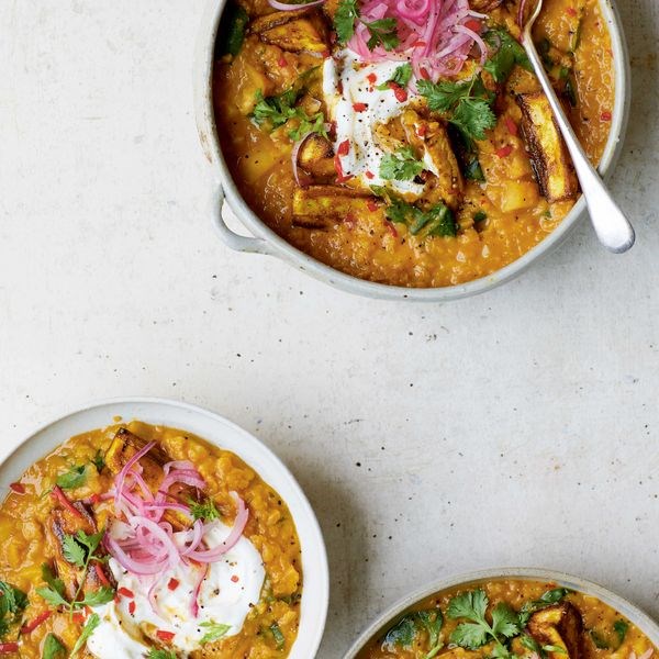 Parsnip dahl topped with roasted parsnips and pink pickled onions