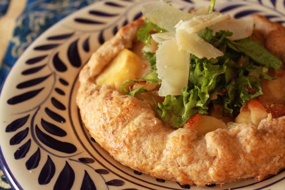 Parsnip galette piled high with late winter greens 